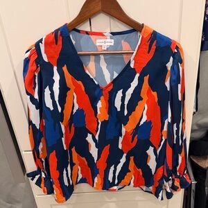 Blue/Orange Patterned Blouse with slight puffed shoulder, flair detail at wrist